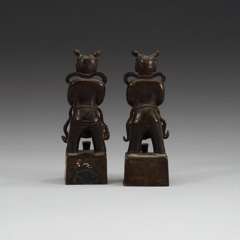 A pair of bronze joss stick holders, Qing dynasty.
