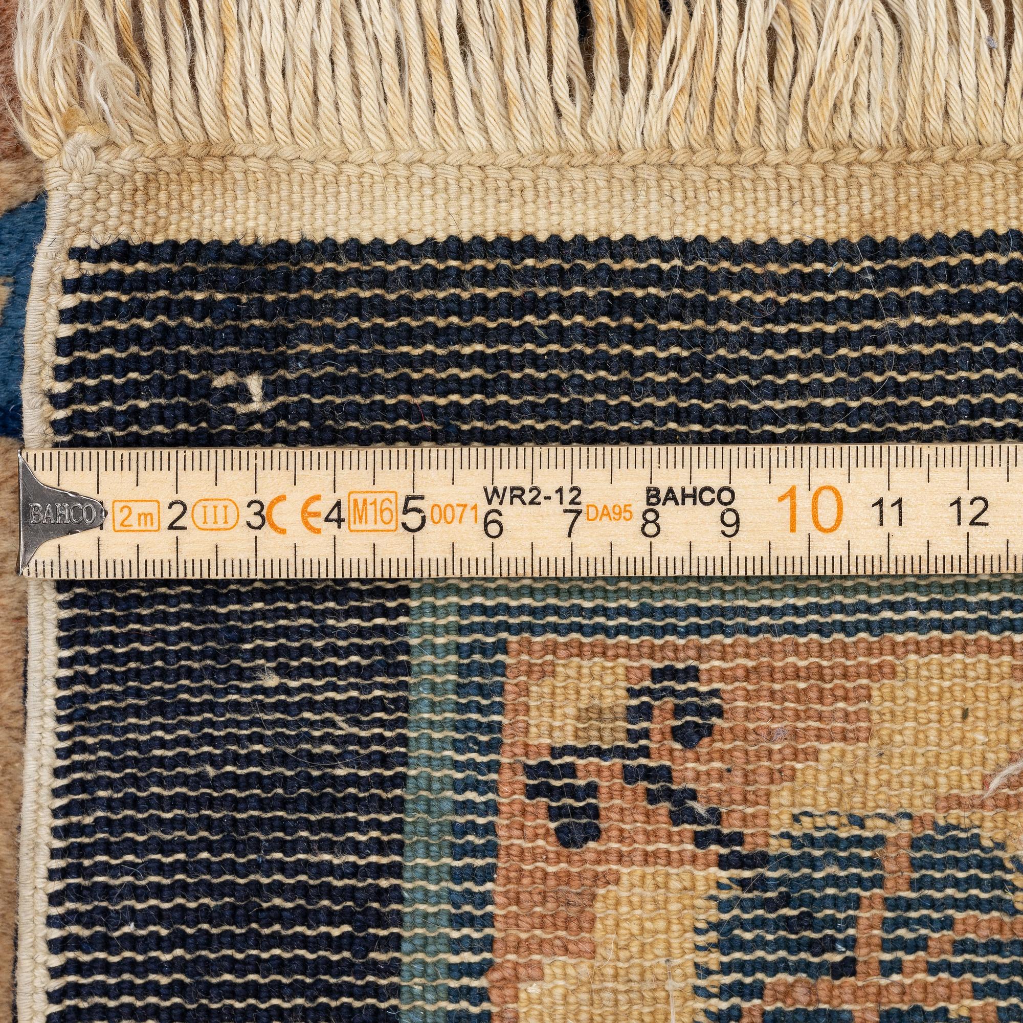 A semi-antique chinese rug, c. 195 x 132 cm .