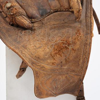A leather saddle of Caucasian type, dated 1821.
