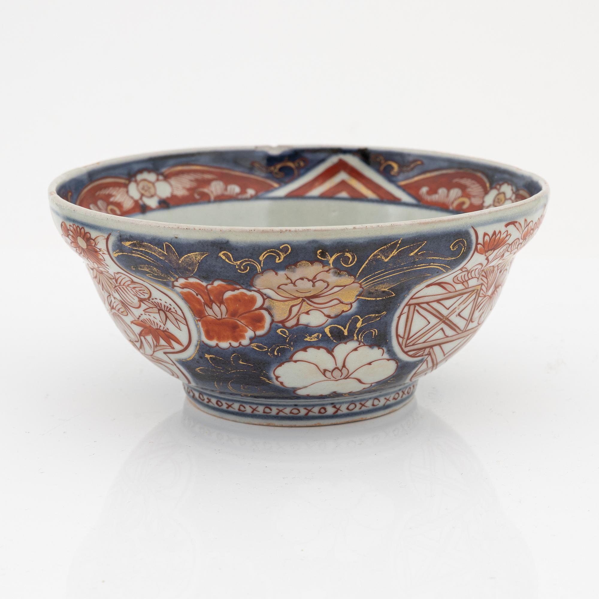 A Chinese dinner plate and a Japanese imari bowl, 18th Century together with a Chinese 19th Century jar with cover.