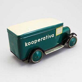 A tinplate biscuit jar in the shape of a truck 1930s.