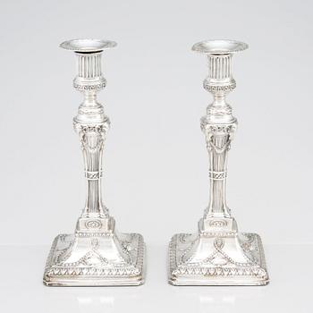 An English pair of 18th Century silver candlesticks, mark of John Winter & Co, Sheffield 1775.