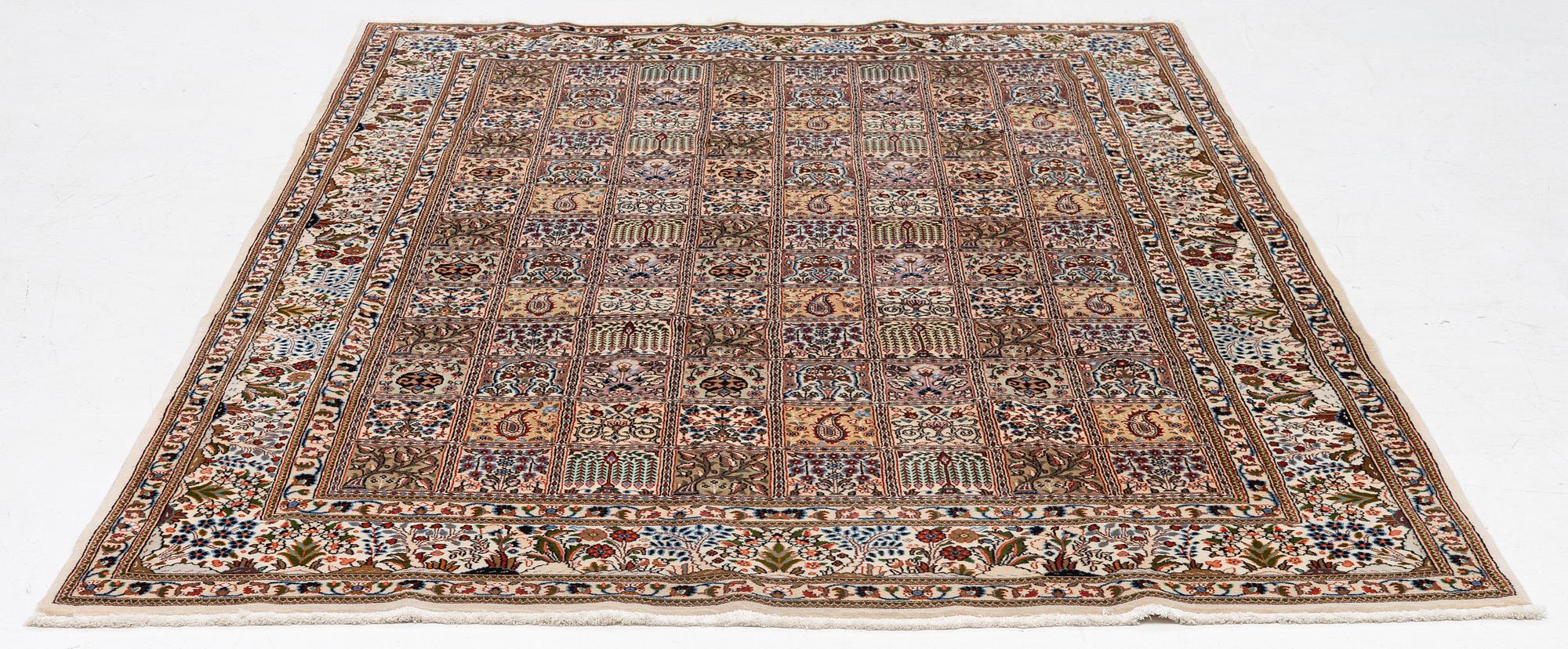 A Moud carpet, part silk, approx. 285 x 195 cm.