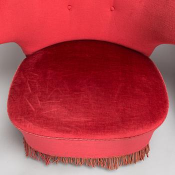 A mid-20th -century sofa and armchair.