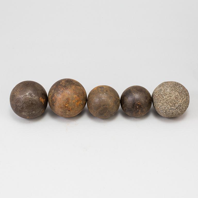 A set of five iron and stone balls.