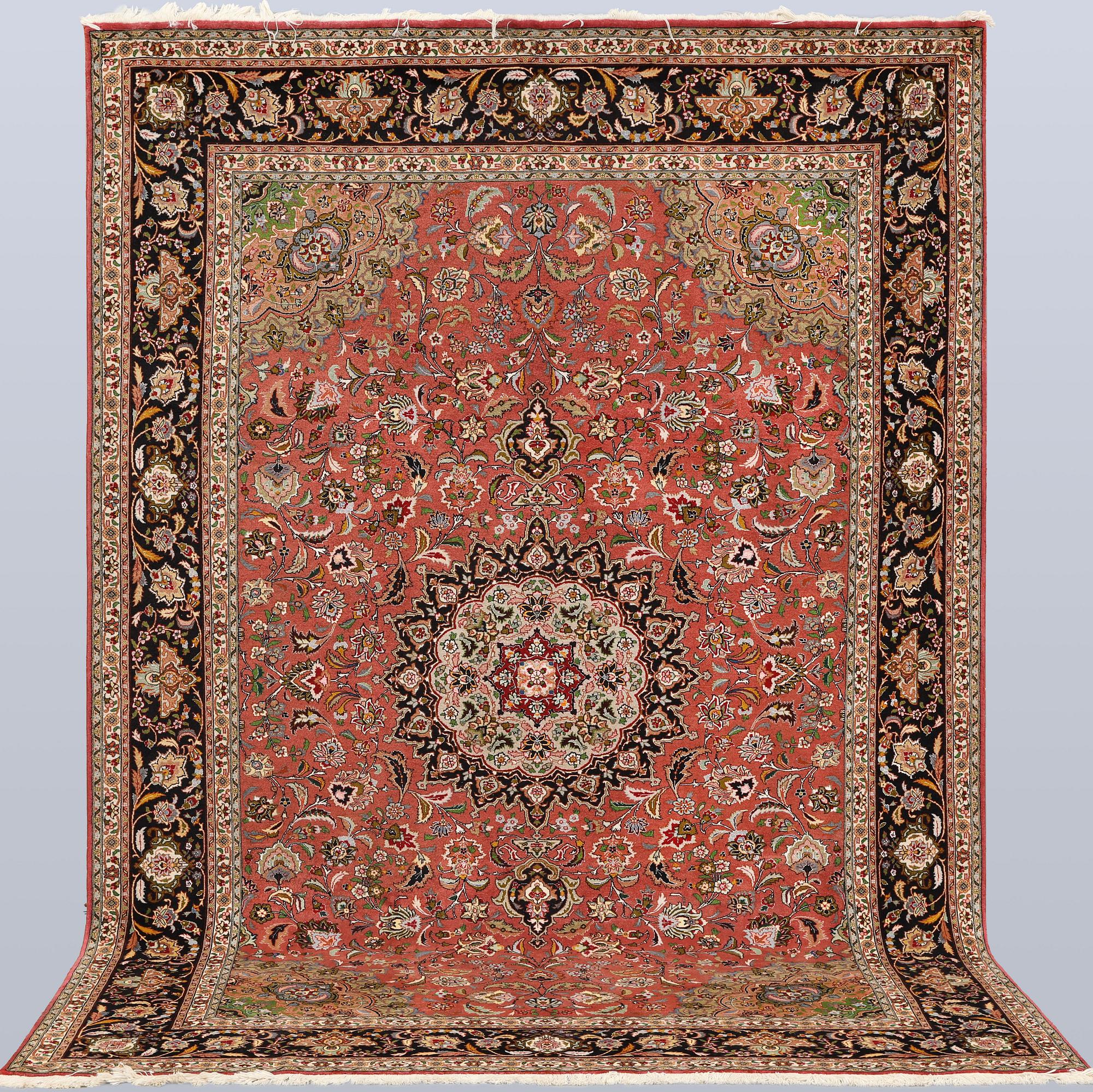 A part silk Tabriz carpet, approx. 50 Raj, 292 x 202 cm.