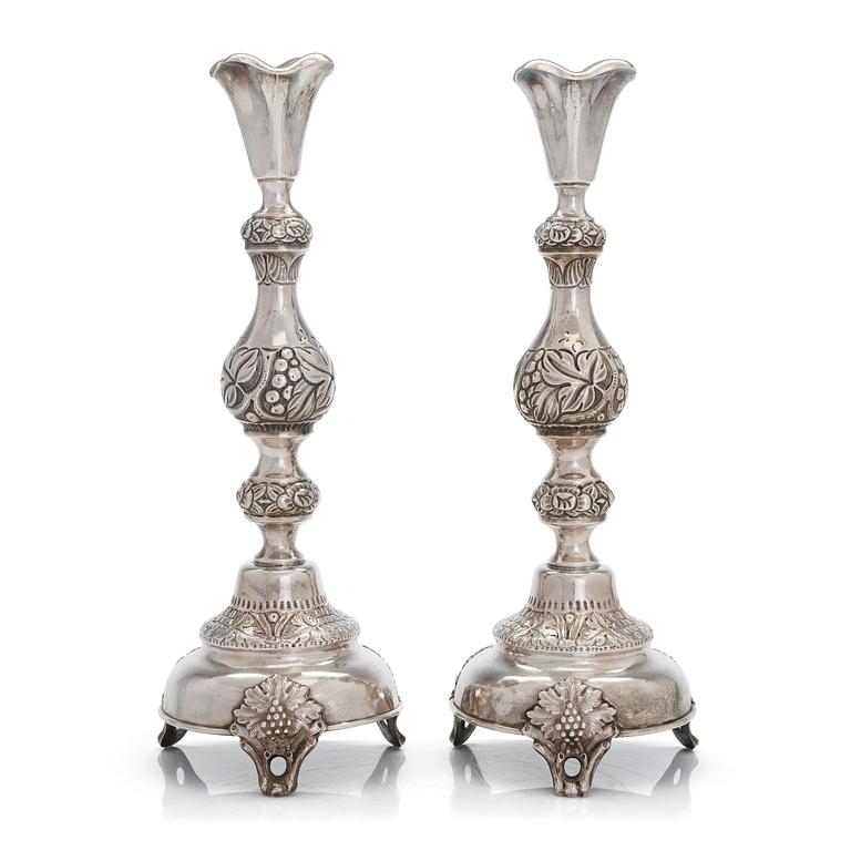 A pair of silver candlesticks from Warsaw, 1880s-90s. Unidentified Cyrillic maker mark FG.