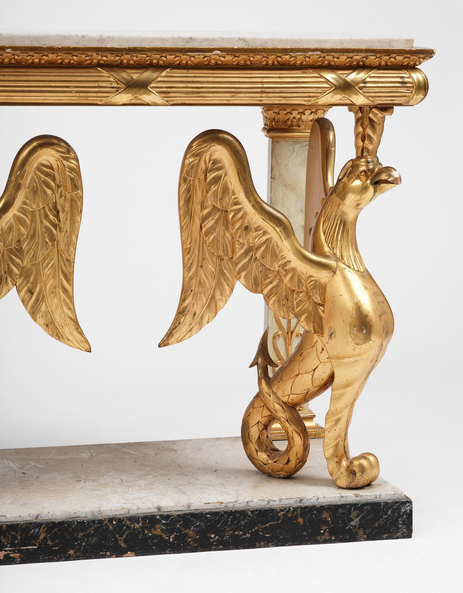 A Swedish Empire gilt wood and white marbel console table.