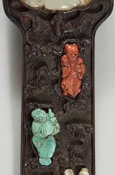 A hardwood Ruyi Sceptre with inlays of nephrite, turquoise, coral and other materials. Qing dynasty, presumably Qianlong.