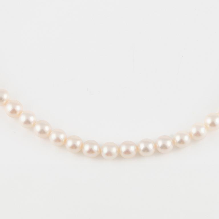 Three strands of cultured pearls, without clasps.