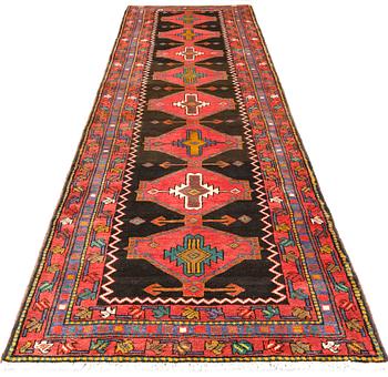 A Tabriz rug, approx. 448 x 114 cm.