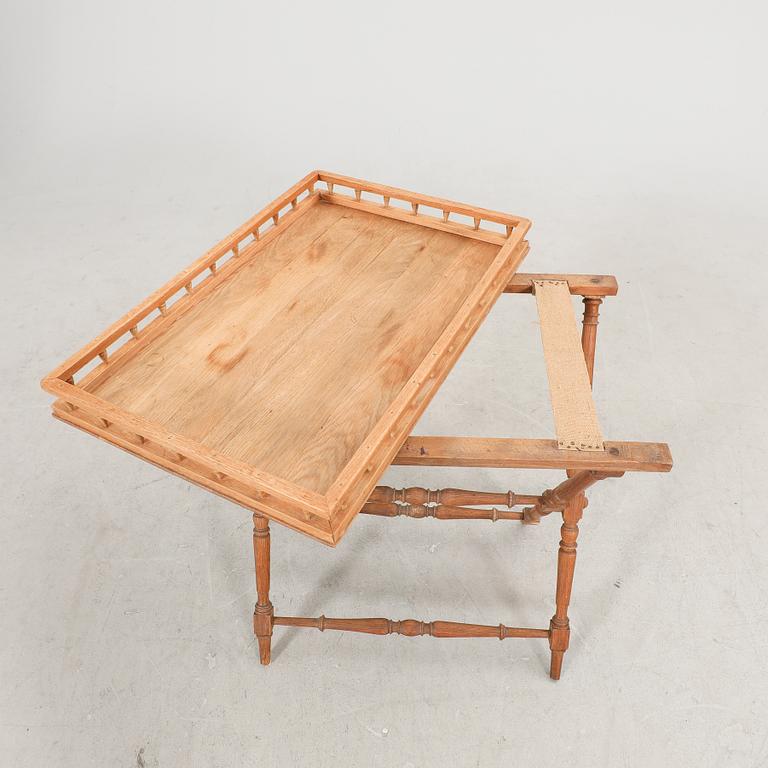 An oak tray table around 1900.