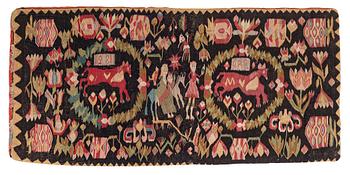250. A Scania carrige cushion, 'Flykten till Egypten', tapestry weave, c. 98 x 47 cm, Oxie district, signed BAD 1821.