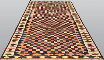 A kilim carpet, ca 333 x 163 cm.