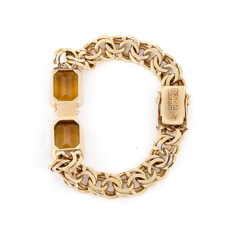 ARMBAND, 18K guld med fasettslipade citriner, NSE, Köping, 1970. Vikt 26,0 gram.