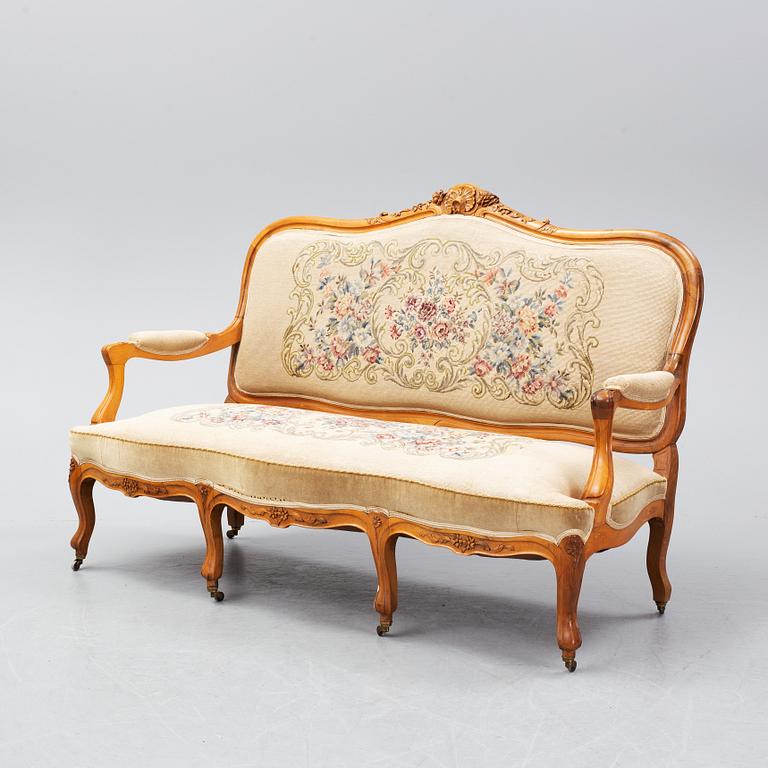 A set of sofa, two armchairs and six chairs, Louis XV-style, ca 1900.