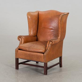 A LEATHER ARMCHAIR, second half of 20th century.