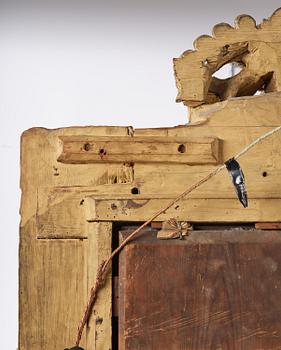 A presumably Dutch Louis XIV carved giltwood frame with mirror glass, in the style of Jean Le Pautre, late 17th century.