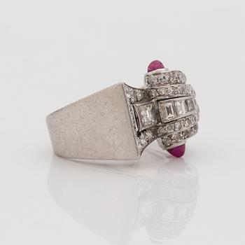 An odeonesque cabochon cut ruby, old- and step- cut diamond ring. Circa 1940's.