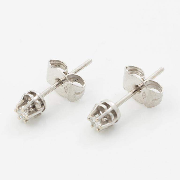 A pair of 18K white gold earrings with round brilliant-cut diamonds.