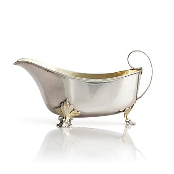 305. A Swedish early 19th century parcel-gilt cream-jug, mark of Johan Wasserman, Lindesberg, Sweden 1810.