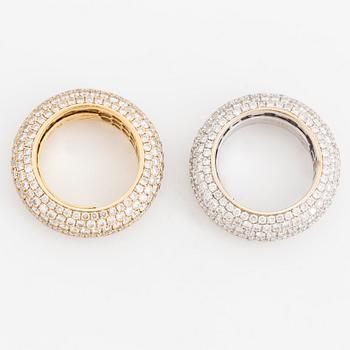 Two brilliant-cut diamond rings.