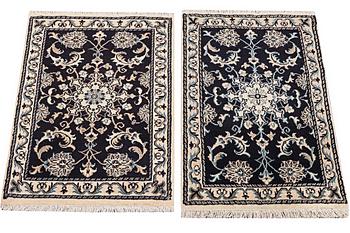 A pair of rugs, Nain, part silk, ca. 93 x 60 cm & ca. 87 x 58 cm.