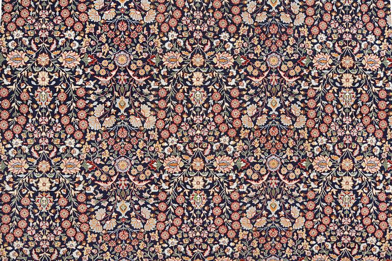 A signed Hereke carpet, ca 340 x 246 cm.