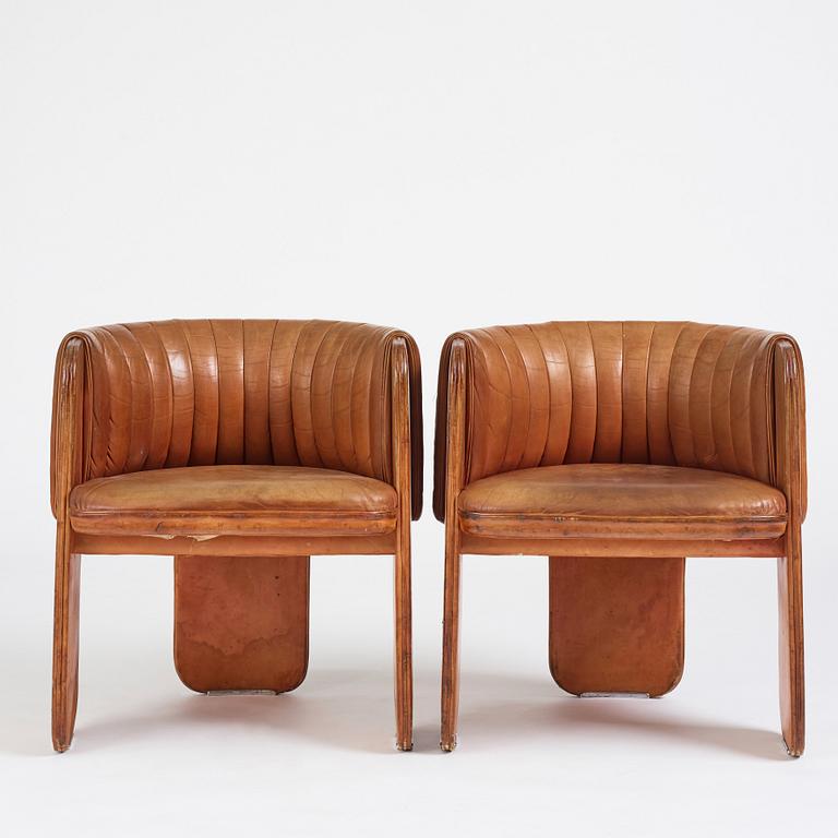 Luigi Massoni, a pair of easy chairs, Poltrona Frau, Italy 1970's.