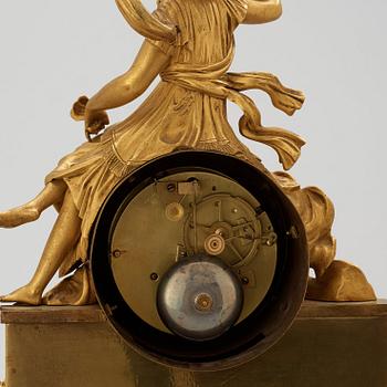 A French Empire early 19th century gilt bronze mantel clock.