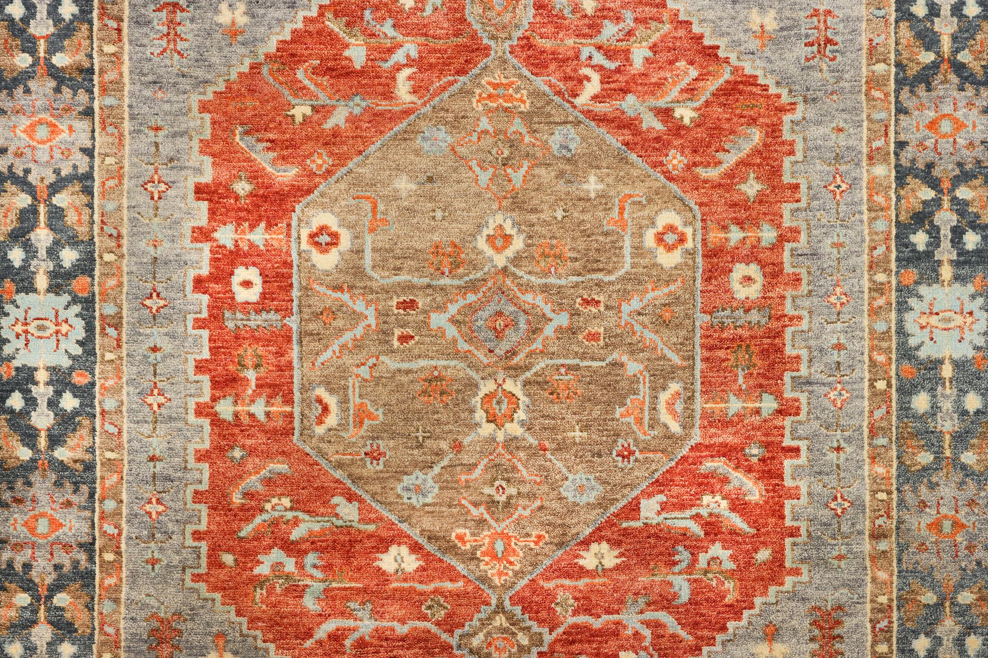 An oriental carpet with Mamluk design, c. 359 x 281 cm.