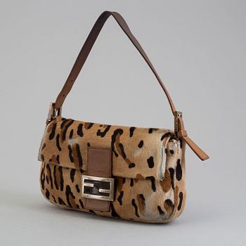 FENDI, a pony hair handbag.