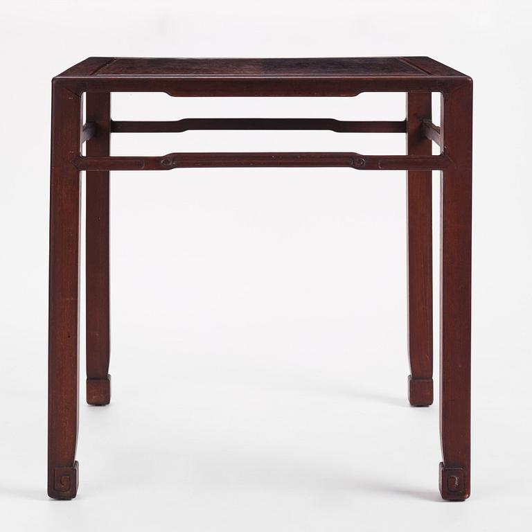 A Chinese hardwood corner-leg table, Qing dynasty.