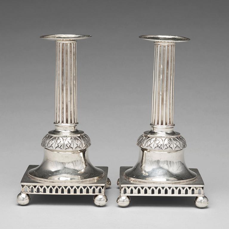 A pair of Swedish aerly 19th century silver candlesticks, mark of Carl Gustaf Blomborg, Stockholm 1815.