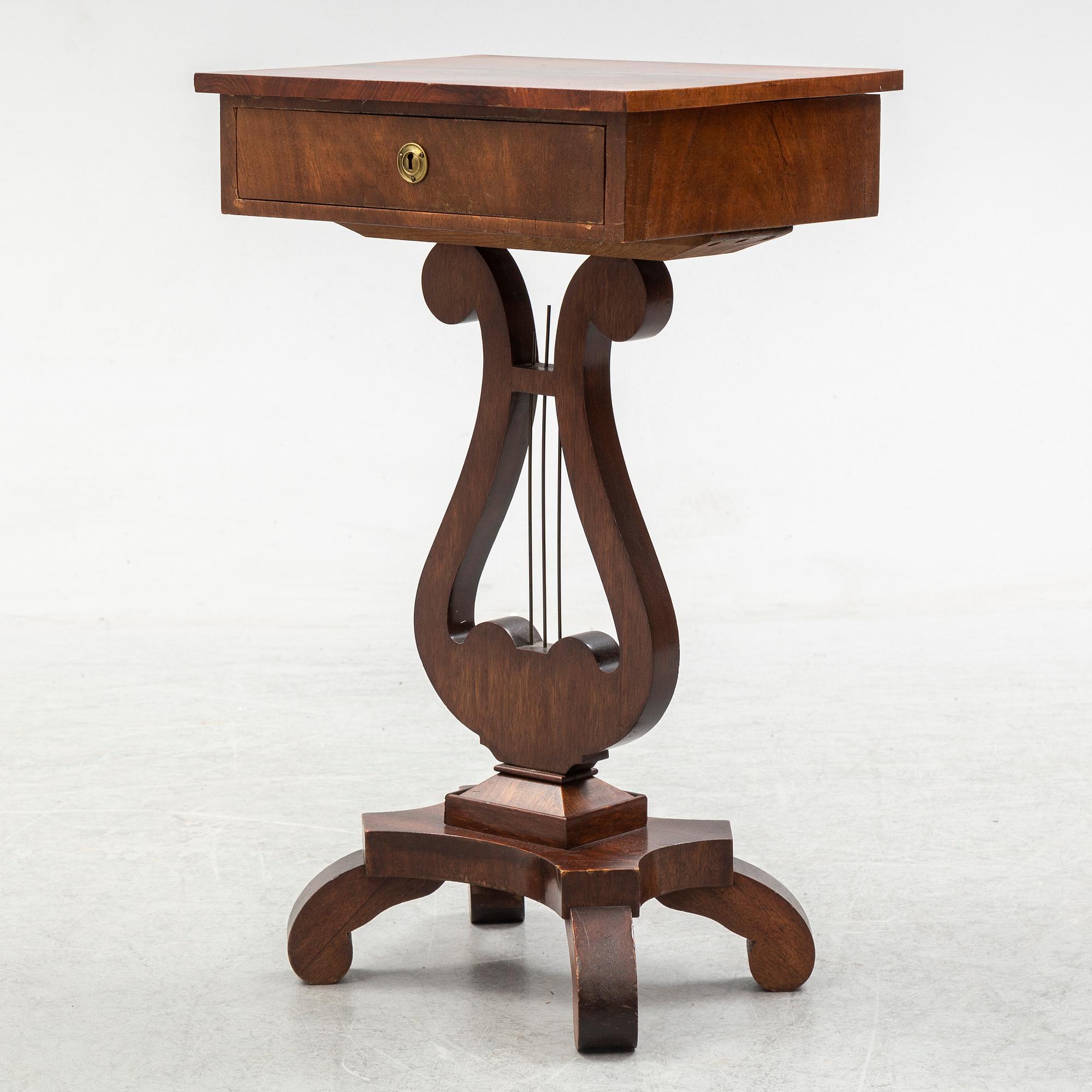 An early 20th century sewing table.