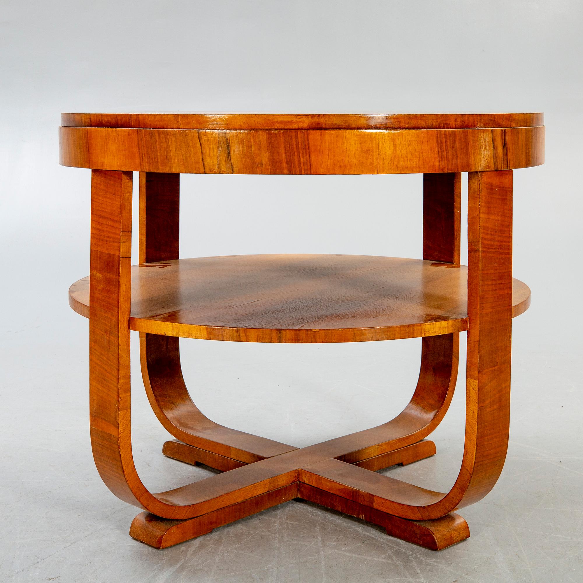 An Art deco style walnut coffee table alter part of the 19th century.