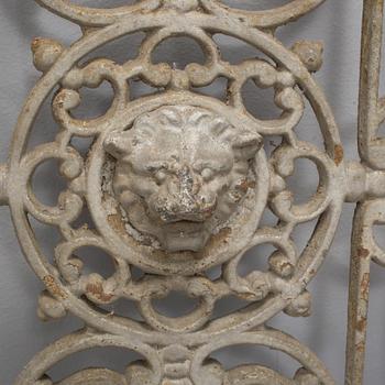 A pair of cast iron decorative elements from the late 19th century.