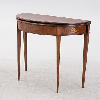 A mahogany-veneered table, presumably Denmark, Empire, first half of the 19th century.