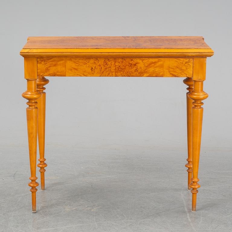 An early 20th Century birch card table.