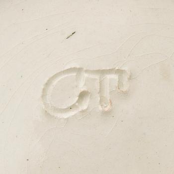 A ceramic bowl signed GT.