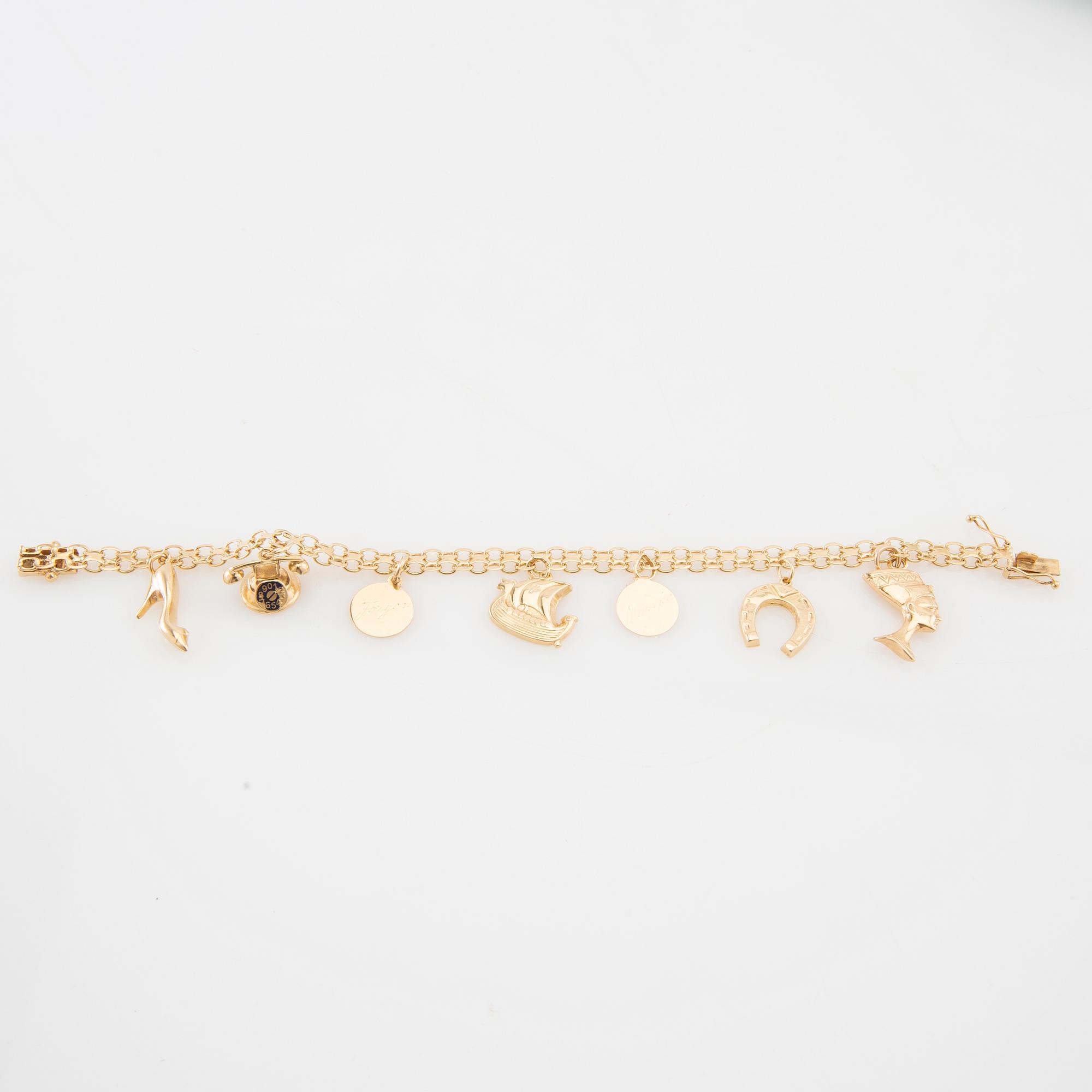 Bracelet 18K gold Bismarck link with charms.
