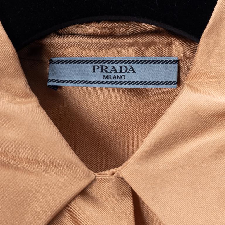 Prada, a apricot silk blouse, size 36.