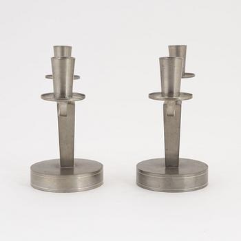 Firma Svenskt Tenn, a pair of pewter two-light candelabra, Stockholm, 1932.