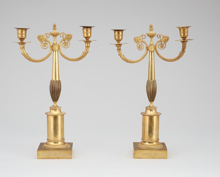 A pair of Swedish Empire 19th century gilt bronze two-light candelabra.