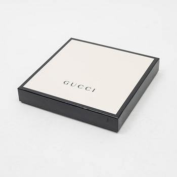 Gucci, a 'Flora' silk scarf.