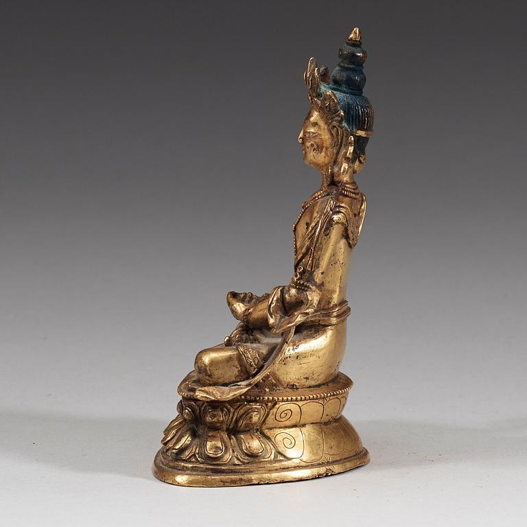 A seated Sino-Tibetan gilt bronze figure of Amitauys, 18th Century.