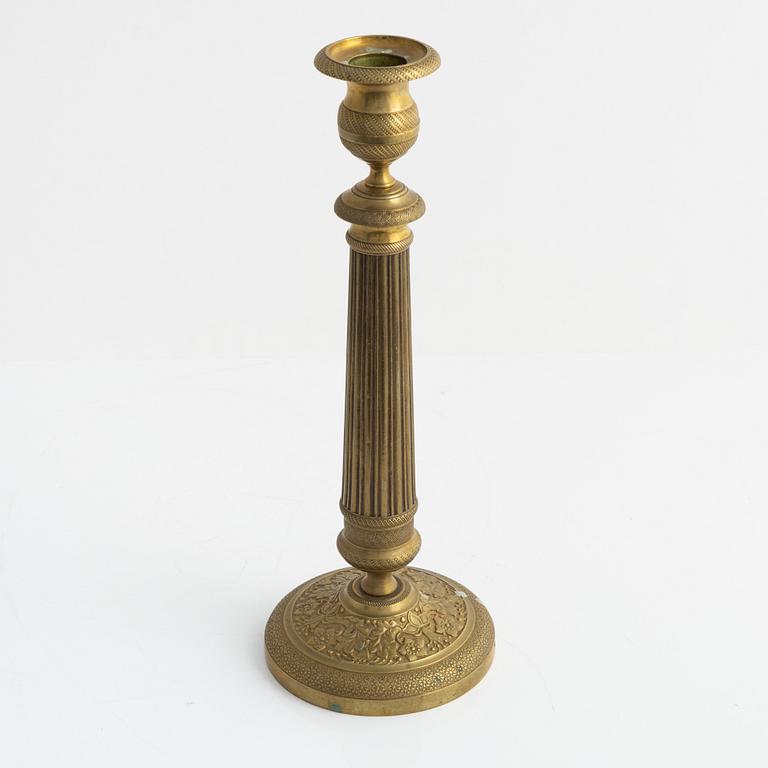 A brass Empire candlestick, first half of the 19th century,