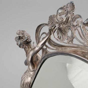 A jugend table mirror in electroplated nickel silver, made in the beginning of the 20th century.