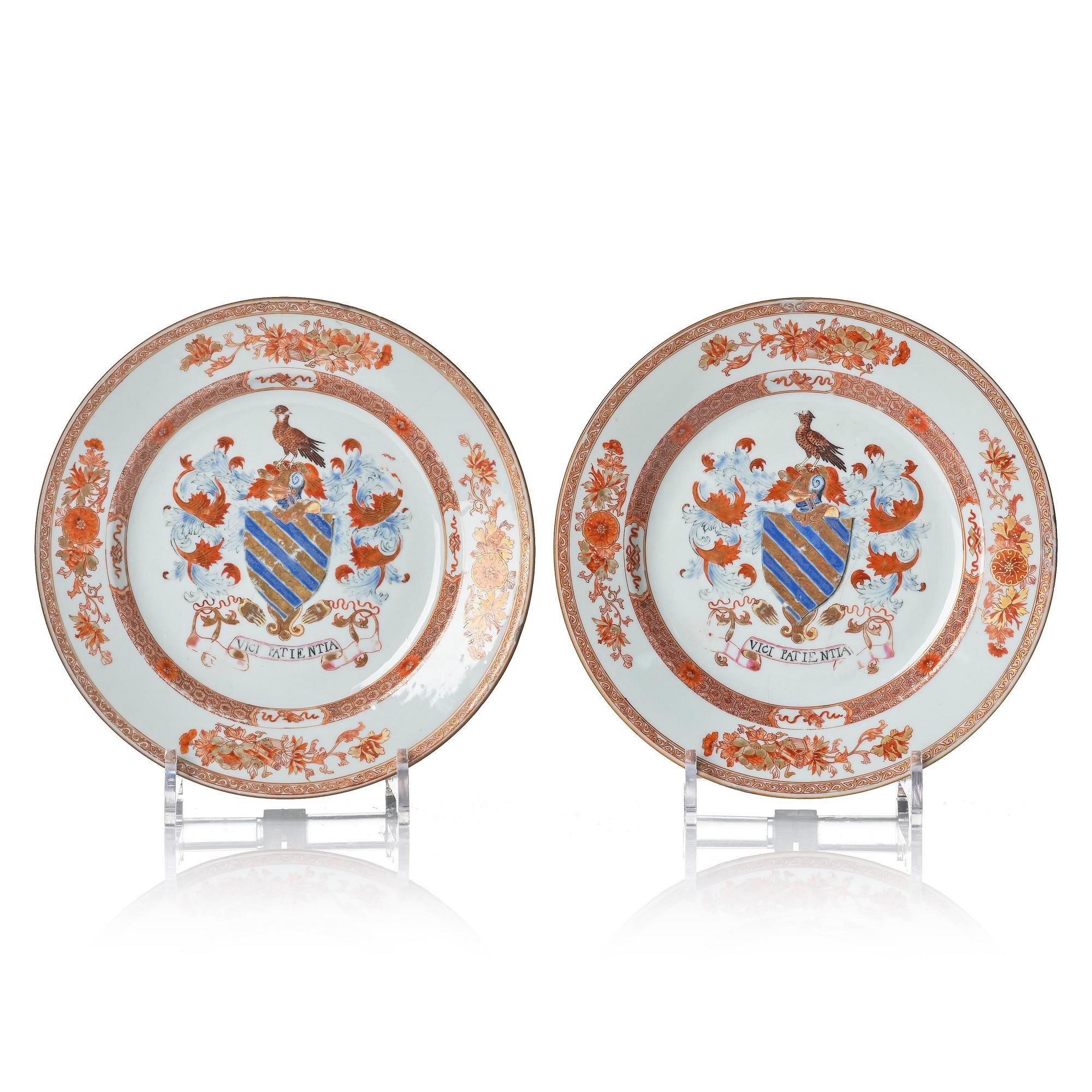 A pair of iron red decorated armorial dishes, Qing dynasty, 18th century.