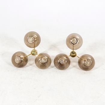 A set of two Hans-Agne Jakobsson brass ceiling pendants later part of the 20th century.